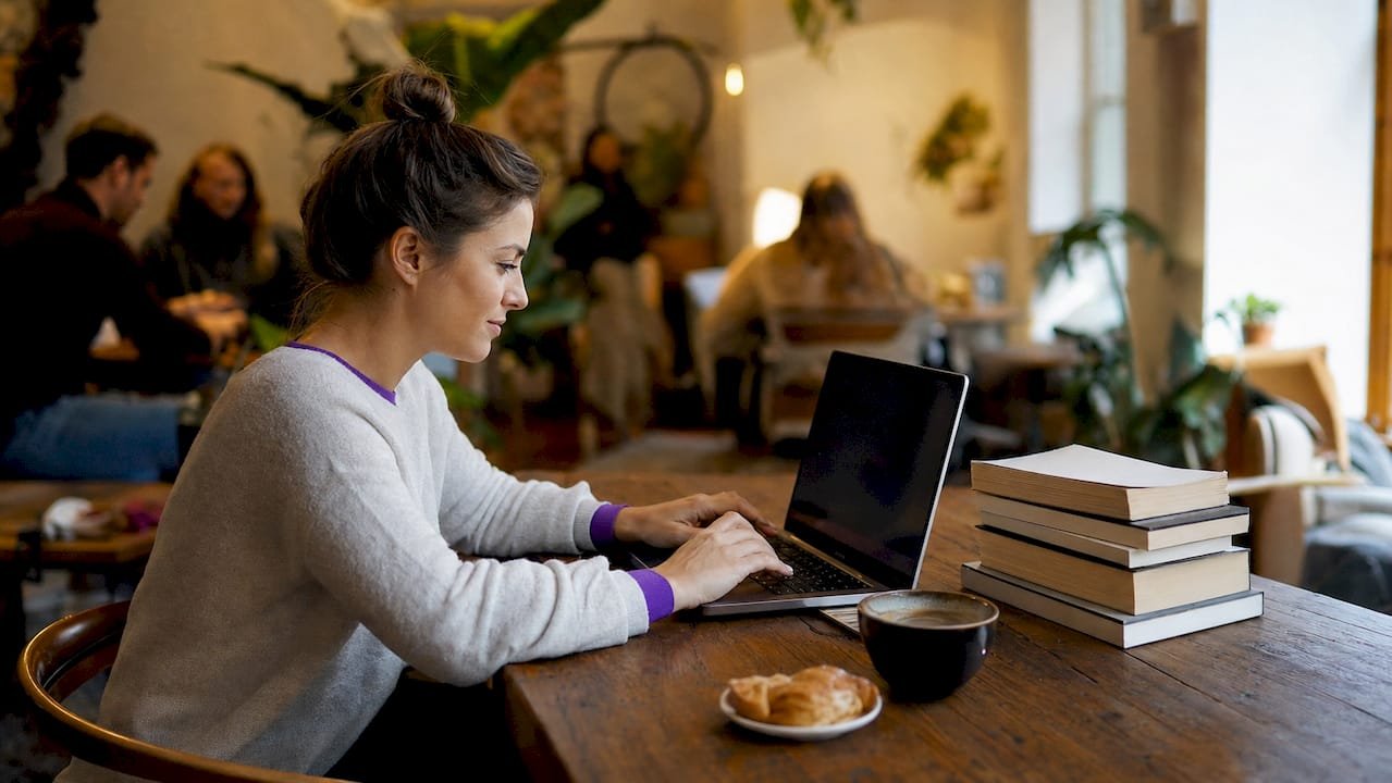 Freelance marketer working at home office desk
