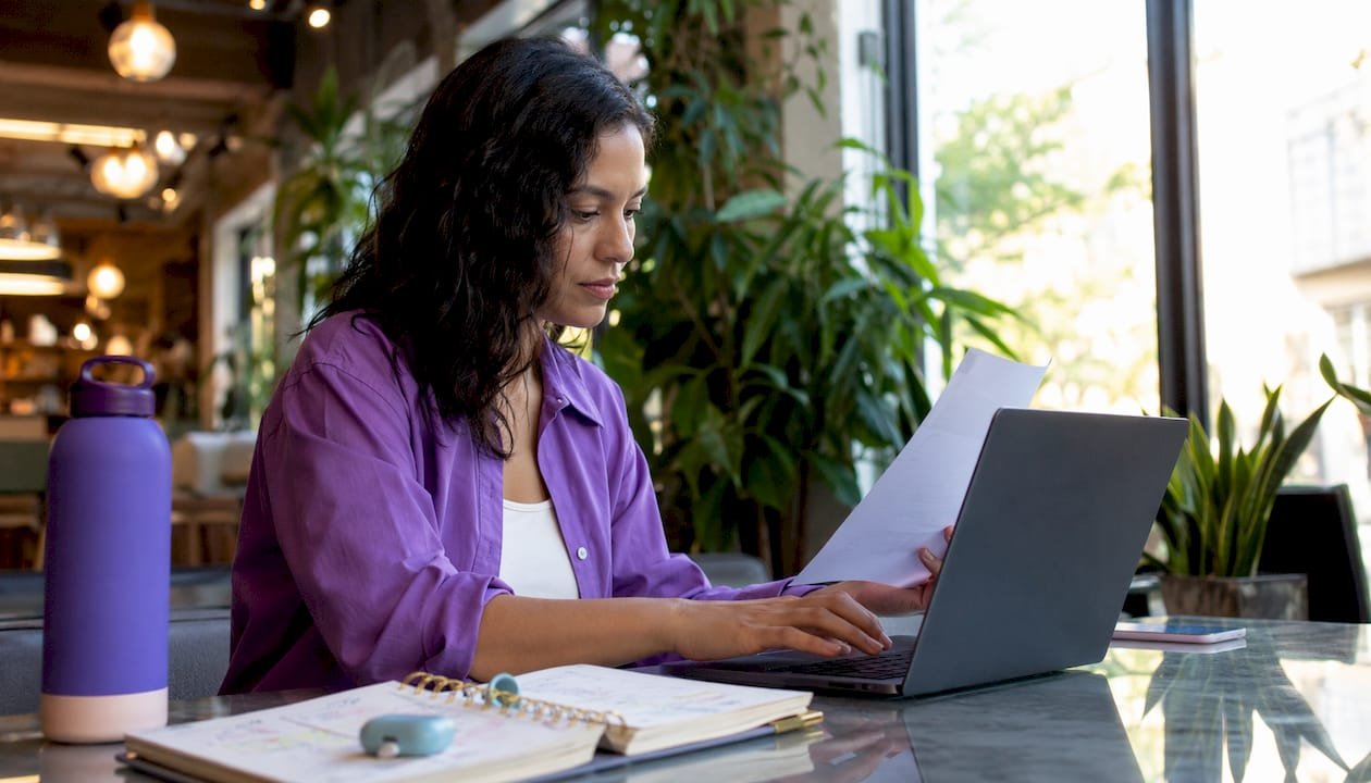 Freelance digital marketer working at home desk