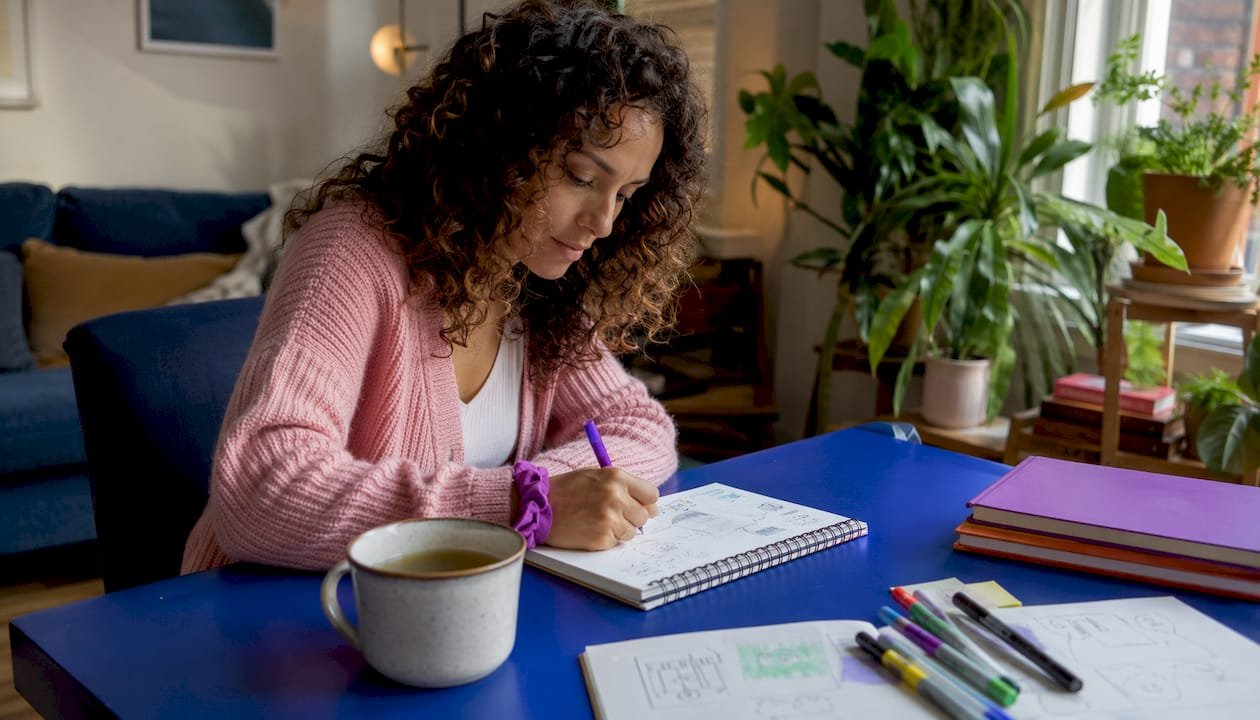 Creative woman journaling in morning ritual
